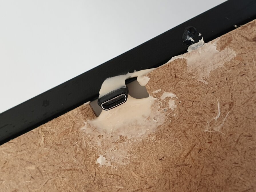 The 90-degrees connector from AliExpress to charge it without taking it out of the frame.